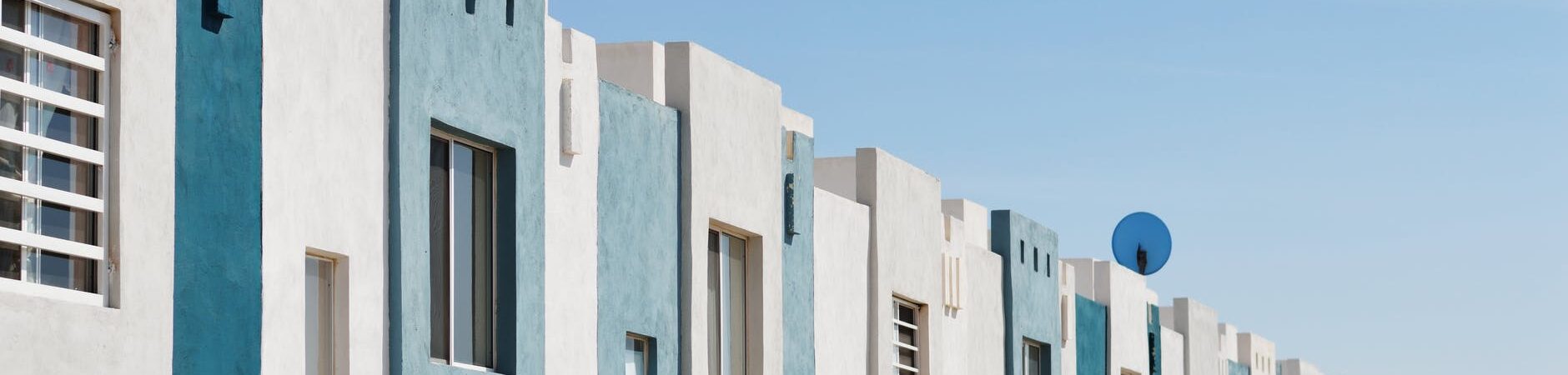 white and teal concrete buildings